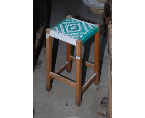 A vintage stool with rope work seat.