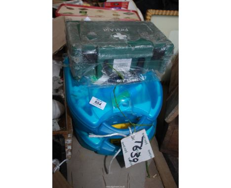 Three boxed First Aid kits.
