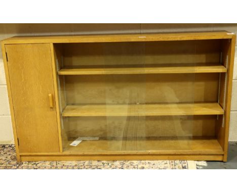 Light oak glazed Criterion bookcase with side cupboard,136 x 25 x 90 cm H. Makers marks Phoenix of Charing Cross to interior.
