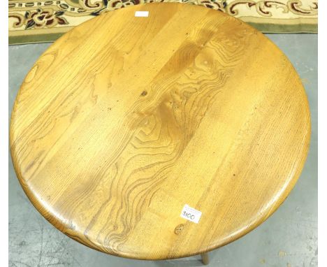 Ercol elm circular occasional table on splayed tapering supports, D: 75 cm. Repair to legs. Not available for in-house P&amp;