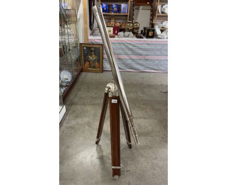 A large silver plated brass telescope on tripod stand. Length 98cm