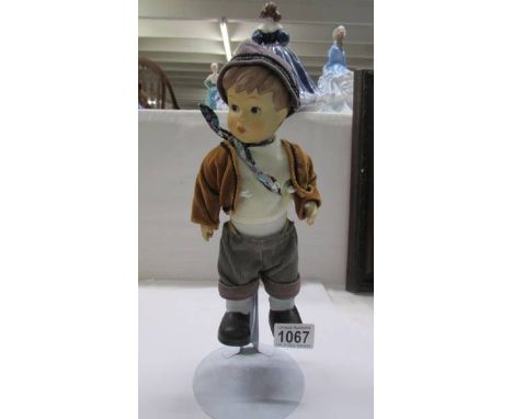 An unusual Goebel boy doll.