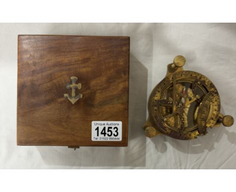 A brass multi sextant / sundial in brass bound teak box