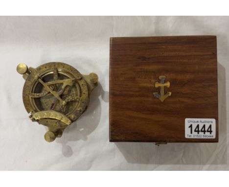 A brass multi sextant / sundial in brass bound teak box