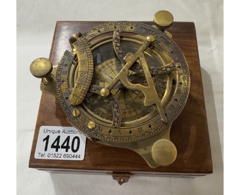 A brass multi sextant / sundial in brass bound teak box