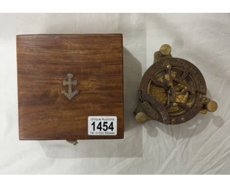 A brass multi sextant / sundial in brass bound teak box