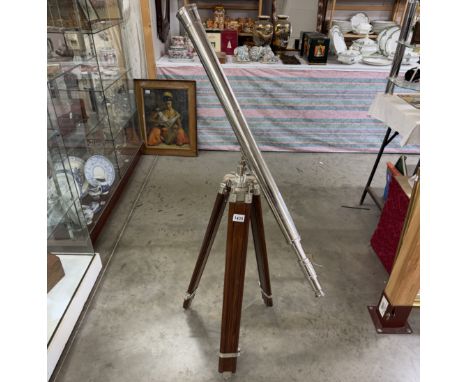 A large silver plated brass telescope on tripod stand. Length 98cm