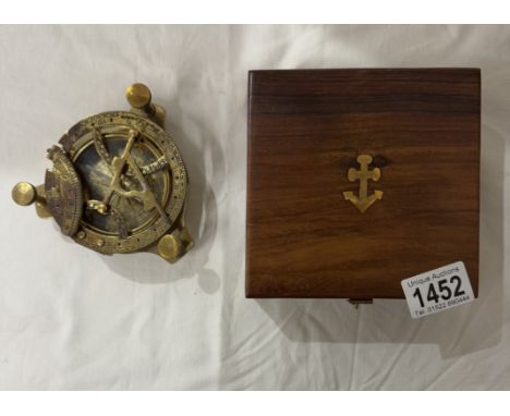 A brass multi sextant / sundial in brass bound teak box