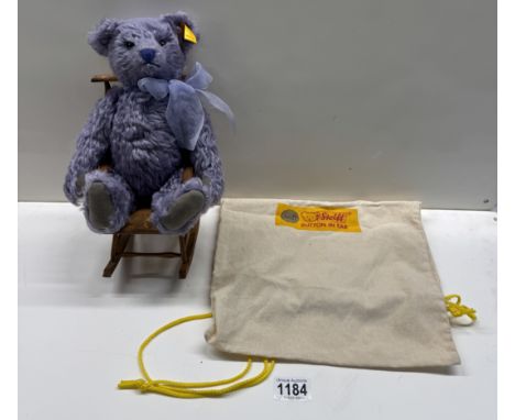 A Steiff lavender bear in rocking chair. (In Steiff bag)