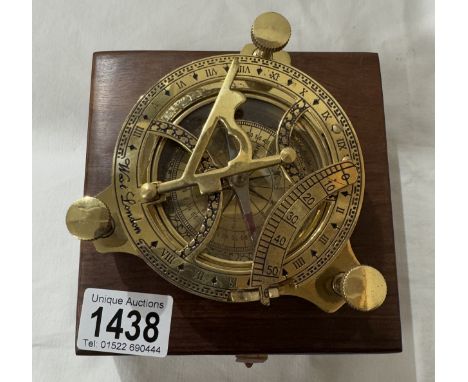 A brass multi sextant / sundial in brass bound teak box
