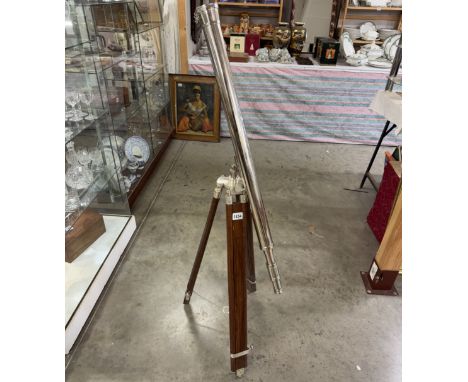 A large silver plated brass telescope on tripod stand. Length 98cm