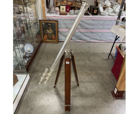 A large silver plated brass telescope on tripod stand. Length 98cm