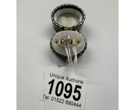 A diamond ring, bright diamonds in a cluster design, HM 18ct London 1979, tapering shoulders, size K, 3.9 grams