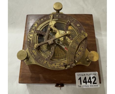 A brass multi sextant / sundial in brass bound teak box