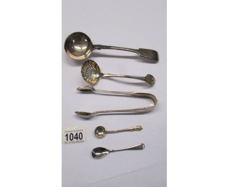 A sauce ladle, a sifter spoon, sugar tongs and two salt spoons.