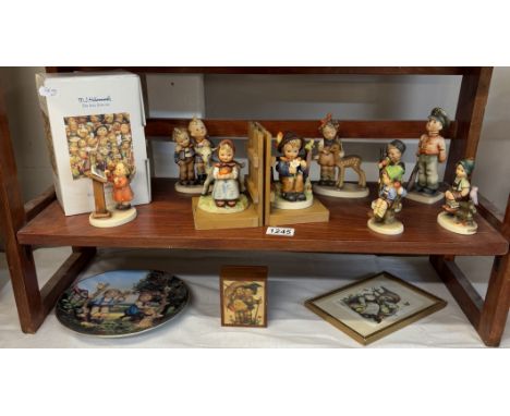 A collection of Hummel/Goebel items including figurine book ends, 7 figurines & plate box etc.Look in good condition but some