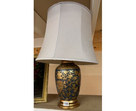 An oriental style ceramic table lamp with shade
