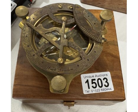A brass multi sextant / sundial in brass bound teak box