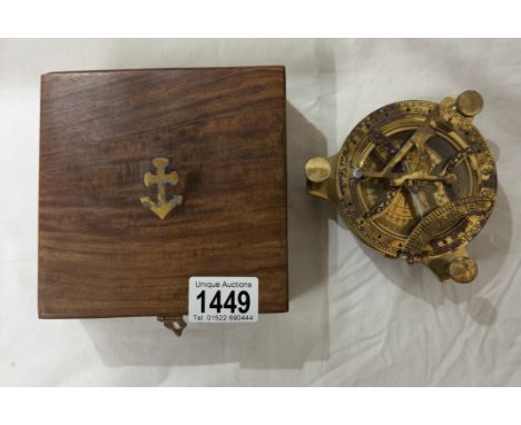 A brass multi sextant / sundial in brass bound teak box