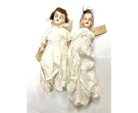 A pair of Gebruder Kuhnlenz bisque head dolls, to include: - An open-mouthed with blue eyed, marked to nape 212 165K 5/o - An