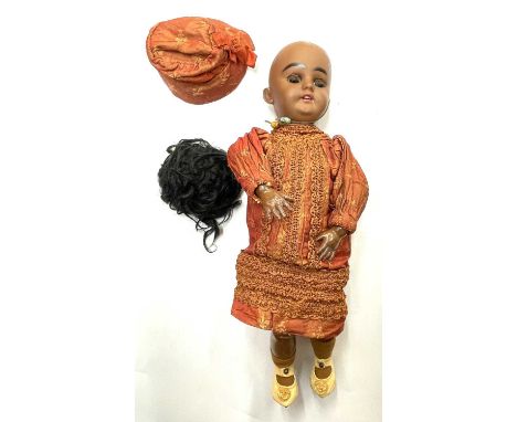 A Simon &amp; Halbig bisque head doll, formed as an Indian girl with flirty eyes operated by a string at the rear.  Detached 