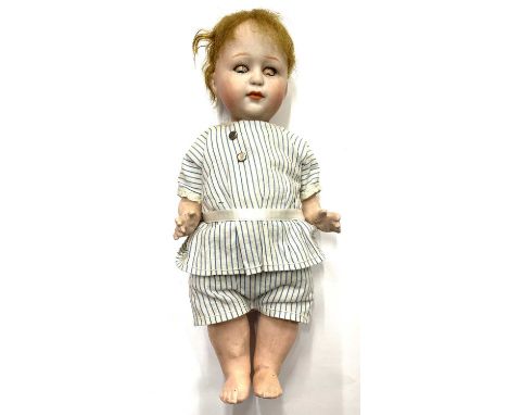 A rare Heubach bisque head doll, in striped outfit. Close-mouthed, blue eyes (damage to eyelids), marked 8420 to head