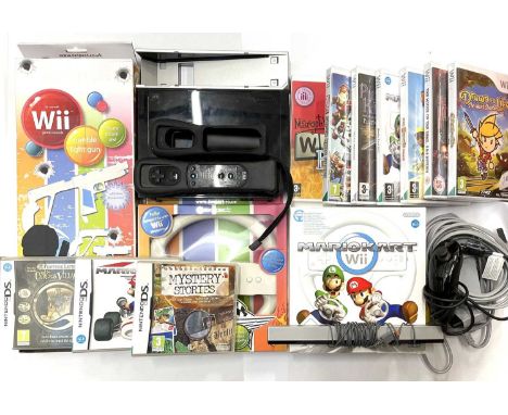 A Nintendo Wii Console in black and a quantity of accessories and games, to include: - Boxed Exspect Racing Wheel- Boxed Exsp
