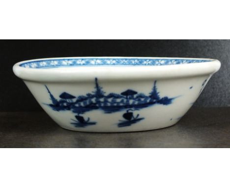 A Caughley tart or patty pan, circa 1780, painted in underglaze blue with the Island pattern, within associated cross-hatched