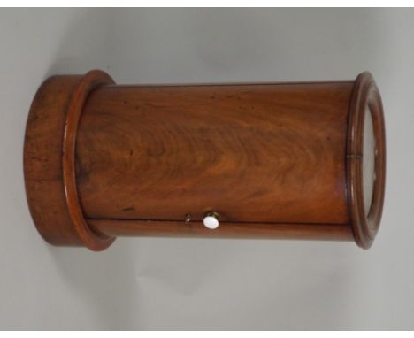 A Victorian mahogany cylinder pot cupboard with inset white marble top over a single door opening to reveal one fixed shelf r