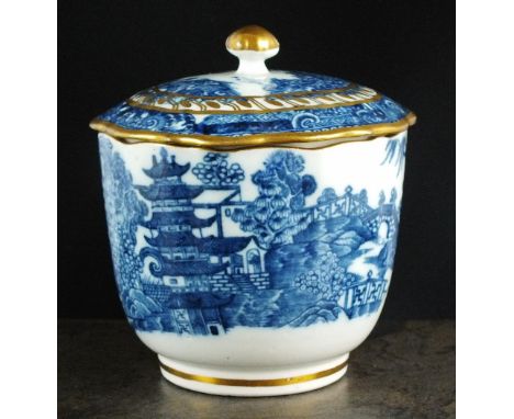 A Caughley sucrier and cover, possibly associated, circa 1785, of reeded shape, transfer-printed in underglaze blue with the 