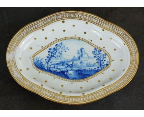 A rare Caughley dessert tureen stand, circa 1788-93, painted in a light, bright underglaze blue colour, combined with an elab