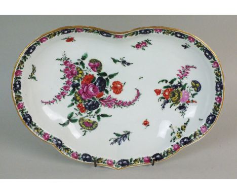 A Worcester kidney-shaped dessert dish, late 18th century, decorated with bold polychrome sprays of roses amongst other flowe