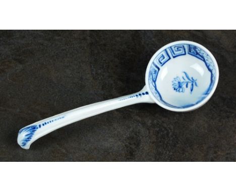A Caughley ladle, circa 1786, painted in underglaze blue with a single flower, between associated border, with leaf moulded s