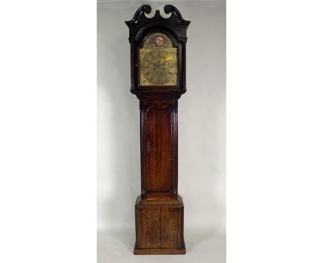 A George III mahogany eight day long case clock.  the 13 inch arched brass dial signed Jn Grindall, Dumfries with centre subs
