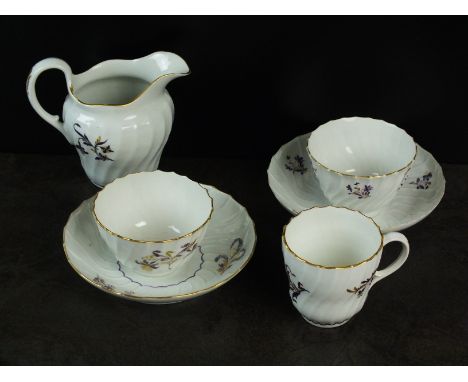 A Flight, Worcester porcelain part tea service, circa 1790, comprising teabowl and saucer, teacup and saucer, and cream jug, 