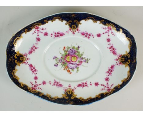 A Worcester porcelain dessert tureen stand, circa 1775, decoration perhaps later, painted in polychrome with an enamelled cen