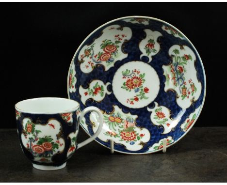 A Worcester scale blue coffee cup and saucer, circa 1770-75, underglaze blue fret mark, cup 6cm high, saucer 13.5cm diameter 