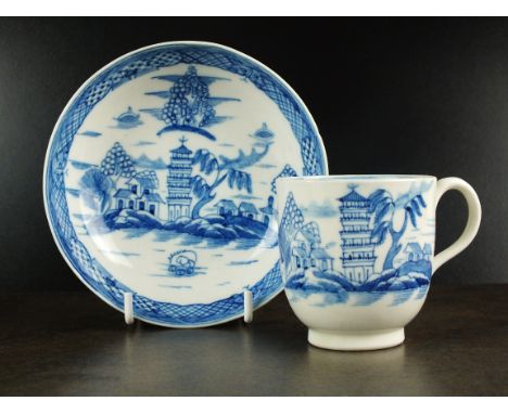 A Caughley coffee cup and saucer, circa 1790-95, painted in underglaze blue with the Tower pattern, with associated borders, 