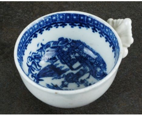 A Caughley wine taster, circa 1780, having moulded leaf handle, transfer-printed in underglaze blue with the Pleasure Boat pa