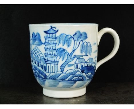 A Caughley coffee cup, circa 1785, painted in underglaze blue with the Tower pattern with an associated internal border, unma
