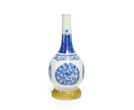 A Gilt Metal Mounted Chinese Porcelain Bottle Vase, the porcelain Kangxi, painted in underglaze blue with lappet shaped panel