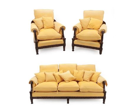 An Adam Style Carved Mahogany Three Piece Bergère Suite, early 20th century, recovered in yellow fabric, comprising a three-s