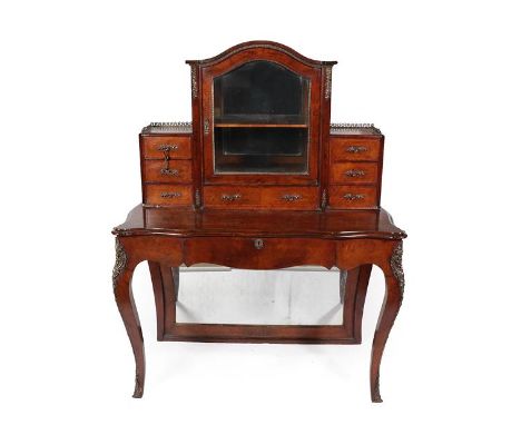 A Victorian Figured Walnut and Gilt Metal Mounted Bureau de Dame, in Louis XV style, the arched top above a central glazed do