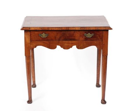 A George I Walnut and Crossbanded Side Table, early 18th century, the moulded top above a single frieze drawer and arched apr