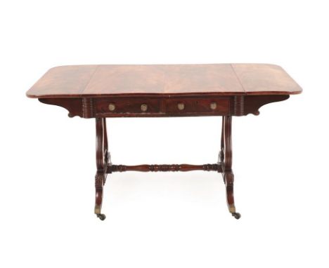 A George IV Mahogany Sofa Table, early 19th century, the rectangular hinged top above two real and opposing dummy drawers, on