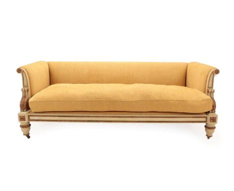 A Cream and Parcel Gilt Sofa, in the manner of William Kent, covered in yellow fabric, with padded back support, overstuffed 
