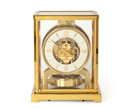 A Brass Atmos Clock, signed Jaeger LeCoultre, 20th century, case with glazed panels, base with stop/start lever, 4-1/4-inch w