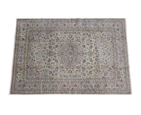 Kashan Carpet Central Iran, circa 1970 The pale celadon field of scrolling vines around a medallion framed by spandrels and p