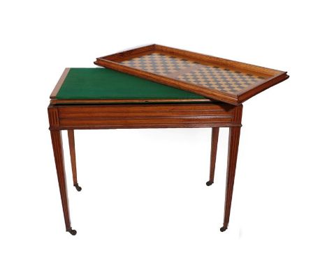 A Late 19th Century Oak Gaming Table, with removable cover, the verso with two gaming boards above a green baize playing surf