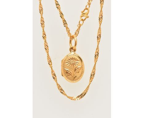 A YELLOW METAL LOCKET AND CHAIN, a small yellow metal oval locket with floral detail, fitted with a large bail, suspended fro